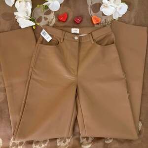 Tan faux leather flare pants